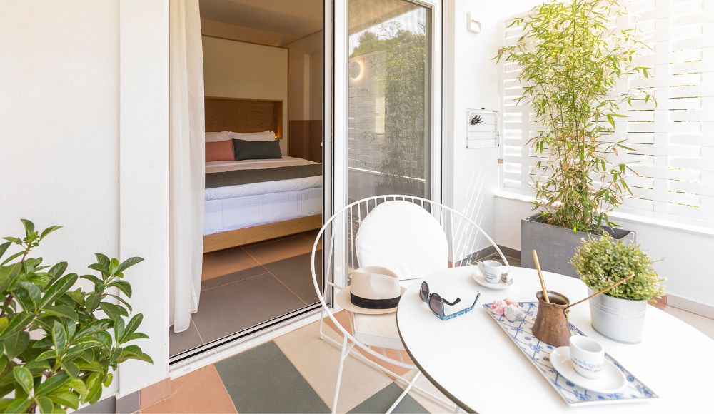 Private balcony overlooking the gardens and pool